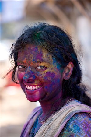 Indian woman celebrating annual Hindu Holi festival of colours with powder paints in Mumbai, formerly Bombay, Maharashtra, India Stock Photo - Rights-Managed, Code: 841-07600124