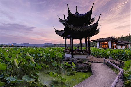 Pavilion, lotus field and zig zag bridge at West Lake, Hangzhou, Zhejiang, China, Asia Stock Photo - Rights-Managed, Code: 841-07782120