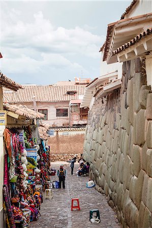 Shops along the the Inca wall at Hathunrumiyoq Street, las piedras del los 12 angulos (Stone of 12 Angles), Cuzco, UNESCO World Heritage Site, Peru, South America Stock Photo - Rights-Managed, Code: 841-07782353