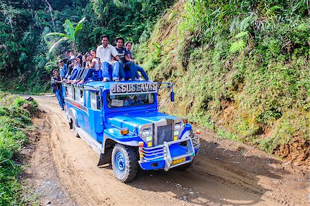 People sitting on a the roof of a jeepney driving through the Hapao rice terraces, Banaue, UNESCO World Heritage Site, Luzon, Philippines, Southeast Asia, Asia Stock Photo - Rights-Managed, Code: 841-07782879