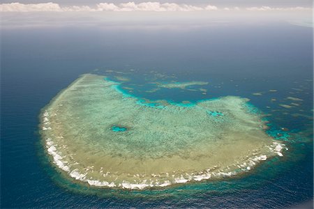 Aerial photography of coral reef formations of the Great Barrier Reef, UNESCO World Heritage Site, near Cairns, North Queensland, Australia, Pacific Stock Photo - Rights-Managed, Code: 841-08059428
