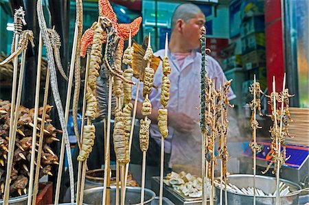simsearch:841-07081180,k - Scorpions, seahorses, starfish and other delicacies on skewers for sale at Wangfujing Street night market, Beijing, China, Asia Stock Photo - Rights-Managed, Code: 841-08101927