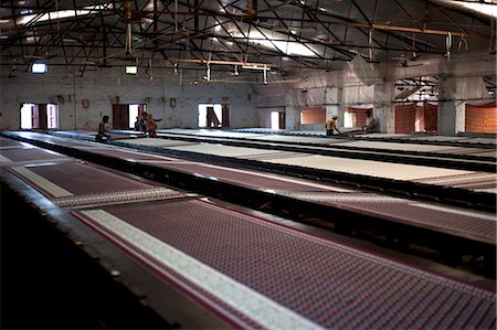 Screenprinting factory, men printing sari lengths of cotton by hand, Bhuj district, Gujarat, India, Asia Stock Photo - Rights-Managed, Code: 841-08211772