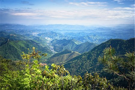 Misty mountain chains and valley with village as seen from Tian Mu Shan peak, Zhejiang, China, Asia Stock Photo - Rights-Managed, Code: 841-08220832