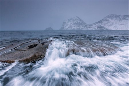 Waves crashing on the rocks of the cold sea, Haukland, Lofoten Islands, Northern Norway, Scandinavia, Arctic, Europe Stock Photo - Rights-Managed, Code: 841-08220861