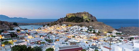 White rooftops of Lindos with the Acropolis of Lindos, Rhodes, Dodecanese, Greek Islands, Greece, Europe Stock Photo - Rights-Managed, Code: 841-08221051