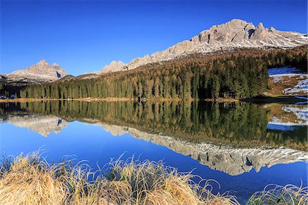 The Three Peaks of Lavaredo and woods reflected in Lake Misurina, Auronzo of Cadore, Dolomites, Veneto. Italy. Europe Stock Photo - Rights-Managed, Code: 841-08357390