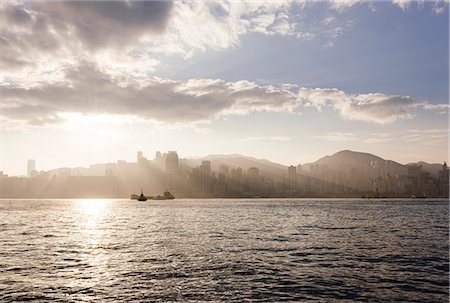 Dawn over Hong Kong Central skyline, Avenue of Stars, Tsim Sha Tsui Waterfront, Kowloon, Hong Kong, China, Asia Stock Photo - Rights-Managed, Code: 841-08357753