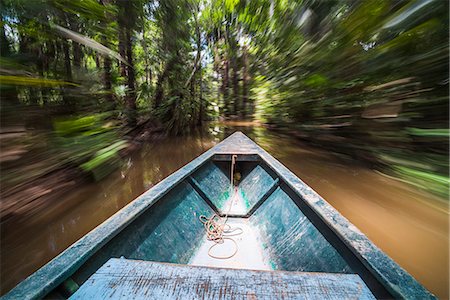 Canoe boat trip in Amazon Jungle of Peru, by Sandoval Lake in Tambopata National Reserve, Peru, South America Stock Photo - Rights-Managed, Code: 841-08420958