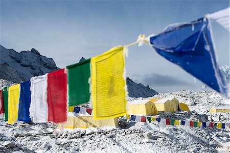 Prayer flags and the Everest base camp at the end of the Khumbu glacier that lies at 5350m, Himalayas, Nepal, Asia Stock Photo - Rights-Managed, Code: 841-08663588