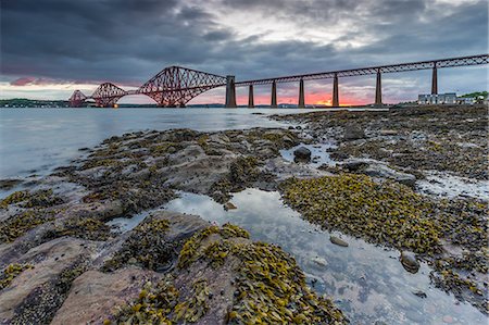 Dawn breaks over the Forth Rail Bridge, UNESCO World Heritage Site, and the Firth of Forth, South Queensferry, Edinburgh, Lothian, Scotland, United Kingdom, Europe Stock Photo - Rights-Managed, Code: 841-08718016