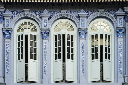 Traditional shophouse windows open out onto a street in the Orchard Road neighborhood in Singapore, Southeast Asia, Asia Stock Photo - Rights-Managed, Code: 841-08781794