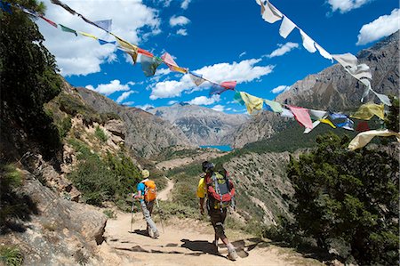 Prayer flags mark a high point in the trail where trekkers are rewarded with their first glimpse of Phoksundo Lake, Dolpa Region, Himalayas, Nepal, Asia Stock Photo - Rights-Managed, Code: 841-08797842