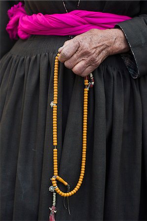 people ladakh - 108 beads are strung on a garland of Buddhist prayer beads, with the beads typically made of fragrant wood like sandalwood, Ladakh, India, Asia Stock Photo - Rights-Managed, Code: 841-08797890