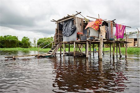 stilt village - Wooden house on stilts in a flooded area of Iquitos, Peru, South America Stock Photo - Rights-Managed, Code: 841-09055358