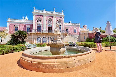 A tourist takes a photo at the entrance of Estoi Palace, in the Algarve, Portugal, Europe Stock Photo - Rights-Managed, Code: 841-09055382
