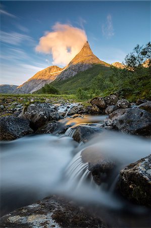 Waterfall frames the Stetinden mountain peak illuminated by midnight sun, Tysfjord, Nordland, Norway, Scandinavia, Europe Stock Photo - Rights-Managed, Code: 841-09085836