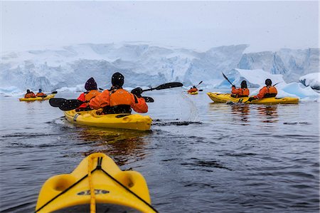 simsearch:400-04747906,k - Expedition tourists kayaking in cold, snowy weather, with icebergs, Chilean Gonzalez Videla Station, Waterboat Point, Antarctica, Polar Regions Stock Photo - Rights-Managed, Code: 841-09162981