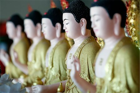 simsearch:841-06341159,k - Row of Buddha statues, Hoi Tuong Te Nguoi Hoa Buddhist Chinese temple, Phu Quoc, Vietnam, Indochina, Southeast Asia, Asia Stock Photo - Rights-Managed, Code: 841-09163363