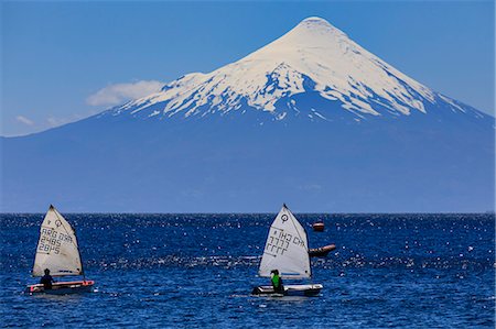 sailing - Sailing on Lake Llanquihue, snow-capped Orsono volcano, from Puerto Varas, Lakes District, Chile, South America Stock Photo - Rights-Managed, Code: 841-09174544