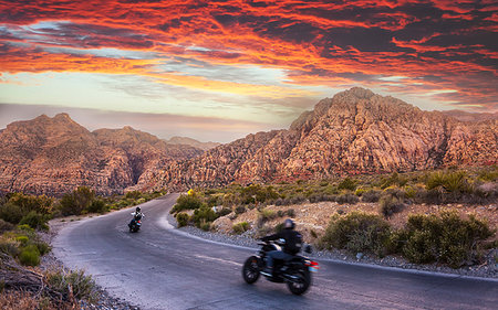 Motocycles driving through The Red Rock Canyon National Recreation Area at sunset, Las Vegas, Nevada, United States of America, North America Photographie de stock - Rights-Managed, Code: 841-09204956