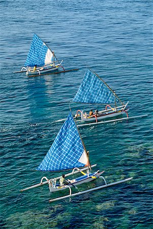 simsearch:841-02899056,k - Fishing boats with blue check sails off Cape Jambela on the east coast of the island of Bali, Indonesia, Southeast Asia, Asia Stock Photo - Rights-Managed, Code: 841-02704013