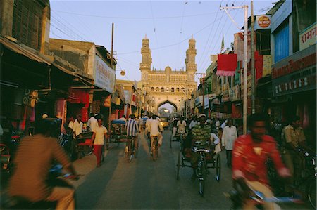 Street scene with bicycles and rickshaw and the Char Minar (Charminar) triumphal arch built in 1591, Hyderabad, Andhra Pradesh State, India Stock Photo - Rights-Managed, Code: 841-02704497