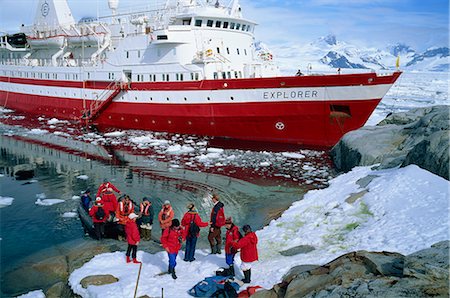 simsearch:841-03066251,k - Passengers take small boat to the Explorer cruise ship anchored close inshore, on the Antarctic Peninsula, Antarctica, Polar Regions Stock Photo - Rights-Managed, Code: 841-02704982