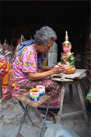 simsearch:841-02946091,k - A woman painting artifacts for temples destroyed by the Khmer Rouge in Phnom Penh, Cambodia, Indochina, Southeast Asia, Asia Stock Photo - Rights-Managed, Code: 841-02706135