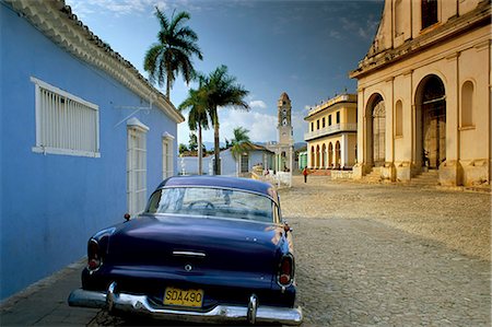 simsearch:841-03035281,k - View across Plaza Mayor with old American car parked on cobbles, Trinidad, Cuba, West Indies, Central America Stock Photo - Rights-Managed, Code: 841-02707636