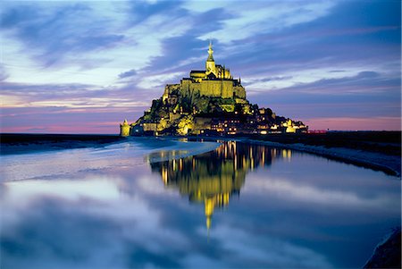 The mount by night reflected in water, Mont St Michel, Manche, Normandy, France Stock Photo - Rights-Managed, Code: 841-02708664