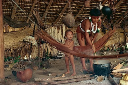 simsearch:841-02709392,k - Yanomami Indian woman cooking, stirring pot, with infant nearby, Brazil, South America Stock Photo - Rights-Managed, Code: 841-02709394