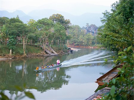 rain forest in malaysia - Outboard powered longboat on the Melinau River, Mulu National Park, Sarawak, island of Borneo, Malaysia, Southeast Asia, Asia Stock Photo - Rights-Managed, Code: 841-02703803