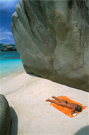 praslin - Woman sunbathing on beach beween rocks, Coco Island, Praslin, Seychelles, Indian Ocean, Africa Stock Photo - Rights-Managed, Code: 841-02715370