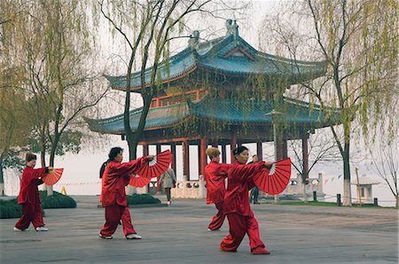 Women practising tai chi in front of a pavilion on West Lake, Hangzhou, Zhejiang Province, China, Asia Stock Photo - Rights-Managed, Code: 841-02716903