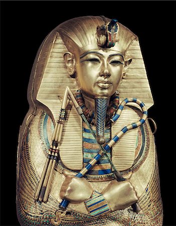 Mummiform coffin of gold with inlaid semi-precious stones and glass-paste, depicting the god Osiris, from the tomb of the pharaoh Tutankhamun, discovered in the Valley of the Kings, Thebes, Egypt, North Africa, Africa Stock Photo - Rights-Managed, Code: 841-02717821