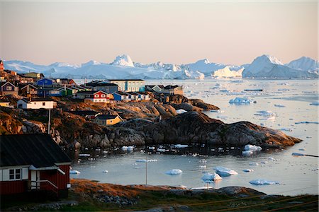 A view over houses and the Ilulissat Kangerlua Glacier also known as Sermeq Kujalleq, Ilulissat, Disko Bay, Greenland, Polar Regions Stock Photo - Rights-Managed, Code: 841-02718476