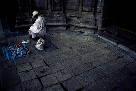 Artist crafting little dolls by church, Mexico City, Mexico, North America Stock Photo - Rights-Managed, Code: 841-02718637