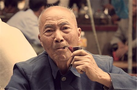 Portrait of a Chinese man smoking pipe, Yangshuo, Guangxi Province, China, Asia Stock Photo - Rights-Managed, Code: 841-02719065