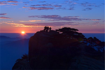 Men watching sunrise, Huang Shan (Yellow Mountain), UNESCO World Heritage Site, Anhui Province, China, Asia Stock Photo - Rights-Managed, Code: 841-02719304