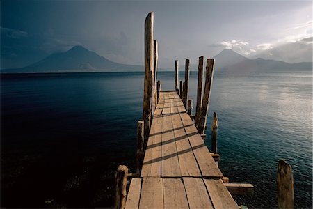 simsearch:862-07495921,k - Wooden jetty and volcanoes in the distance, Lago Atitlan (Lake Atitlan), Guatemala, Central America Stock Photo - Rights-Managed, Code: 841-02719608