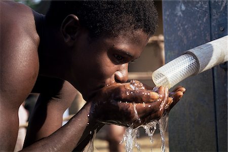 simsearch:841-02946644,k - Teenage boy drinking from new UNICEF well, Vahun, Liberia, West Africa, Africa Stock Photo - Rights-Managed, Code: 841-02712170