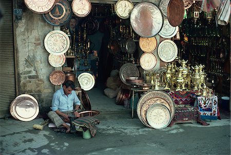 Man working on copper plate outside a copper souk, Baghdad, Iraq, Middle East Stock Photo - Rights-Managed, Code: 841-02713059