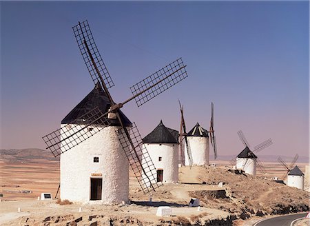 Windmills above the village, Consuegra, Ruta de Don Quixote, Castilla La Mancha, Spain, Europe Stock Photo - Rights-Managed, Code: 841-02713438