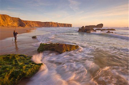 people at portugal beaches - Fisherman on Tonal beach at sunset, blurred milky water, Sagres, Algarve, Portugal, Europe Stock Photo - Rights-Managed, Code: 841-02713874