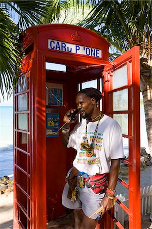 red call box - Traditional English red telephone box on the beach at Dickenson Bay, Antigua, Leeward Islands, West Indies, Caribbean, Central America Stock Photo - Rights-Managed, Code: 841-02722231