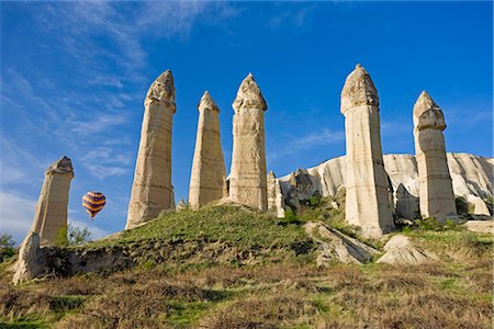 Hot air balloon over the phallic pillars known as fairy chimneys in the valley known as Love Valley near Goreme in Cappadocia, Anatolia, Turkey, Asia Minor, Eurasia Stock Photo - Rights-Managed, Code: 841-02722391