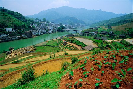 Rice paddies and brick-maker at Longsheng in northeast Guangxi Province, China Stock Photo - Rights-Managed, Code: 841-02722942