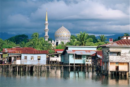 stilt houses south east asia - Stilt village and State Mosque in Kota Kinabalu, Asia's fastest growing city and capital of Sabah, northern tip of Borneo, Malaysia, Southeast Asia, Asia Stock Photo - Rights-Managed, Code: 841-02722988