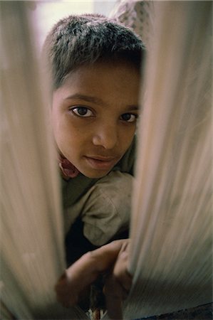 Child working in carpet factory in the 1970s, Lahore, Pakistan, Asia Stock Photo - Rights-Managed, Code: 841-02824344